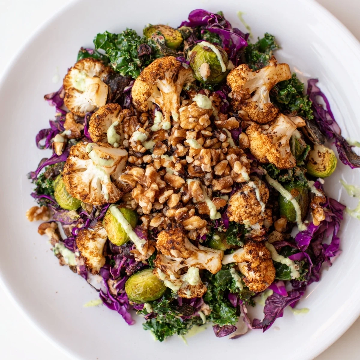 Steaming roasted winter vegetables atop baby kale in a vibrant Winter Garden Keto Grain Bowl.