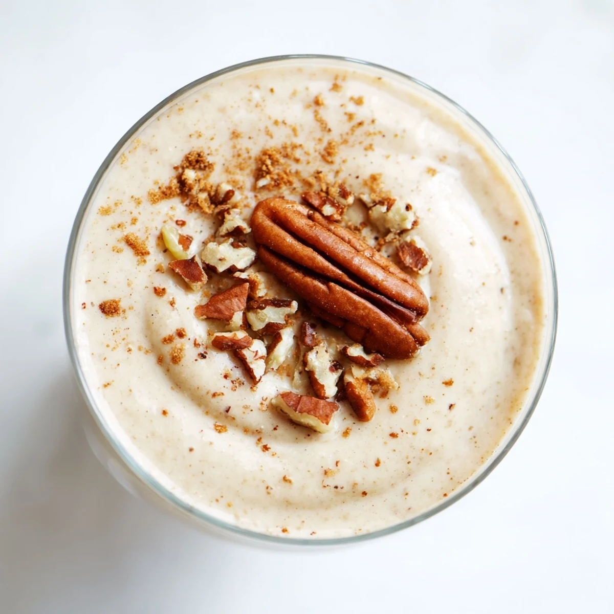 Creamy textured Fireside Vegan Smoothie with roasted apple and pear, swirled with cinnamon.