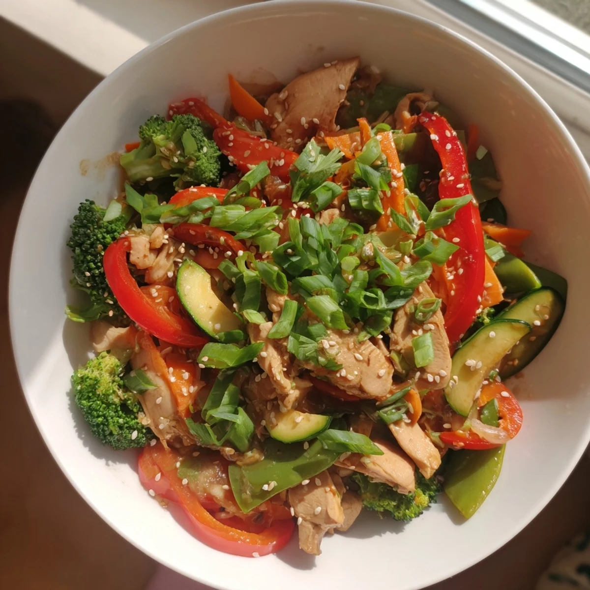 Tender chicken and colorful vegetables mingle in a healthy, flavorful Seasonal Glow Paleo Stir Fry preparation.