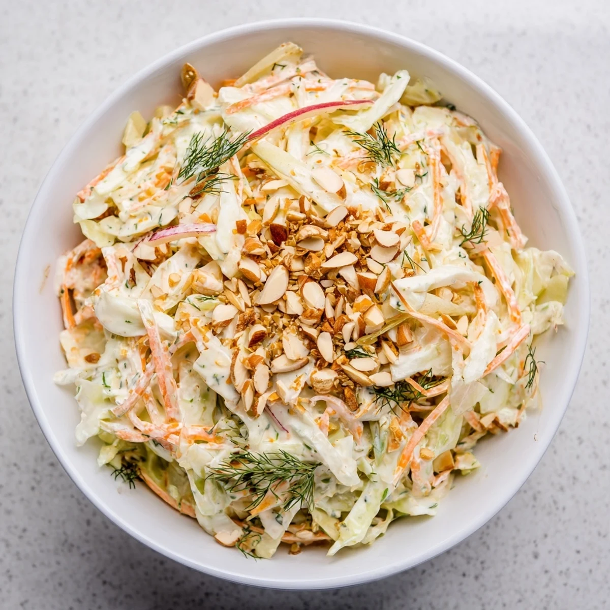 A bright bowl of Snowy Day Low Fat Salad with crisp napa cabbage, orange segments, and toasted almonds for crunch.