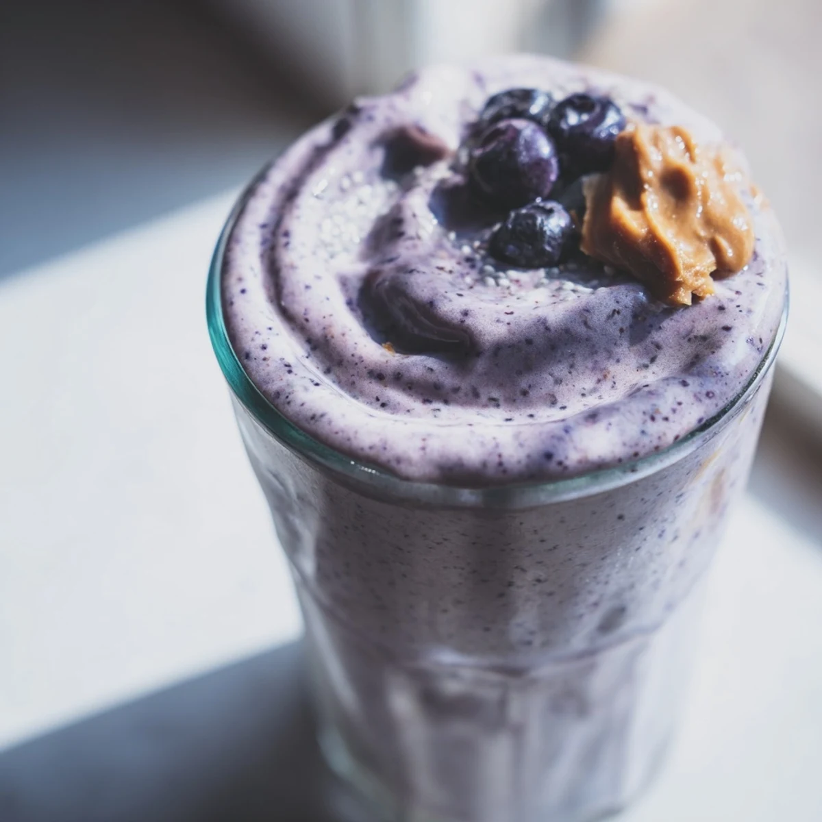 Creamy Frosty Morning Keto Smoothie in a tall glass, topped with chia seeds and a sprinkle of cinnamon, perfect for a low-carb breakfast.
