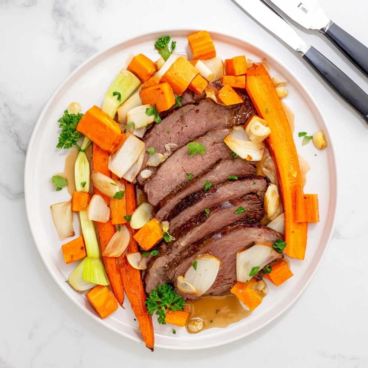 Sliced beef roast with golden vegetables steaming on a plate for a cozy, paleo-friendly winter dinner.
