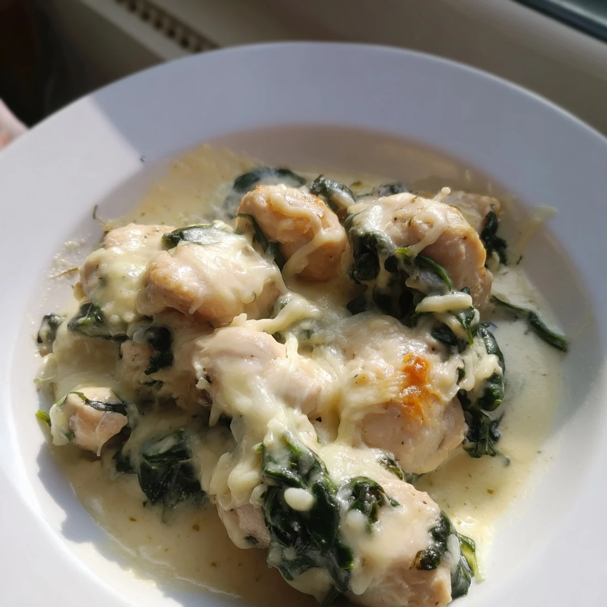 Serving suggestion: a warm, bubbly Snowy Day Low Carb Chicken Casserole topped with melted mozzarella and fresh herbs.  