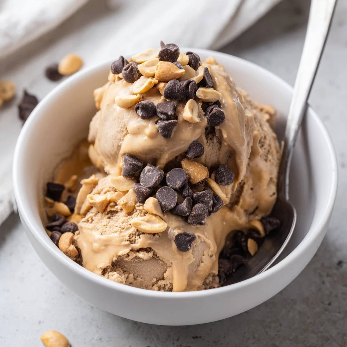 Smooth Chocolate Peanut Butter Protein Nice Cream blended with frozen bananas and cocoa powder in a food processor.