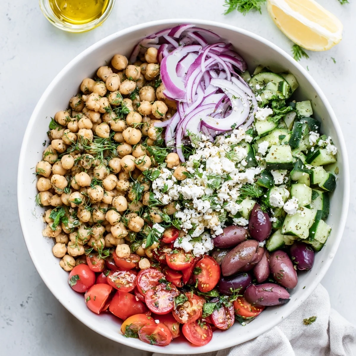 Protein-packed Mediterranean chickpea and cucumber herb salad drizzled with lemon olive oil dressing
