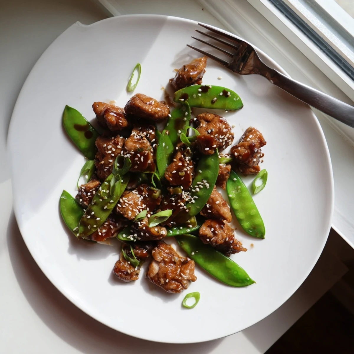 Savory Japanese-style Miso Ginger Chicken stir-fry with crisp snap peas in a rich umami glaze