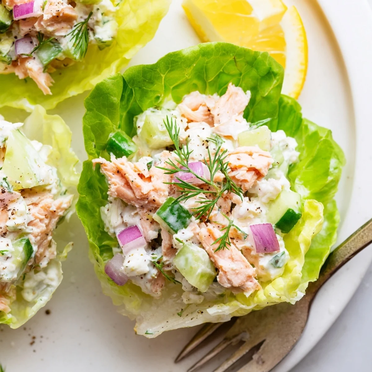 Cottage Cheese Lemon Herb Salmon Salad Cups ready to serve with lemon and parsley