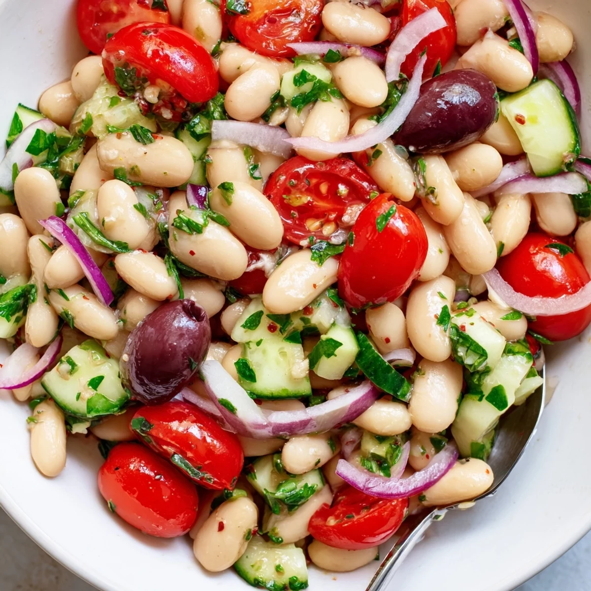 Chilled Mediterranean White Bean and Tomato Cucumber Salad served with grilled pita wedges