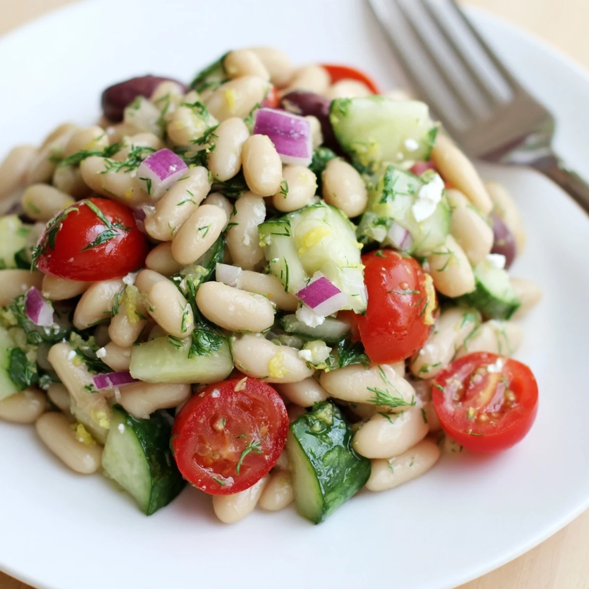 Bowl of Mediterranean White Bean and Cucumber Dill Salad, crisp cucumbers, creamy beans