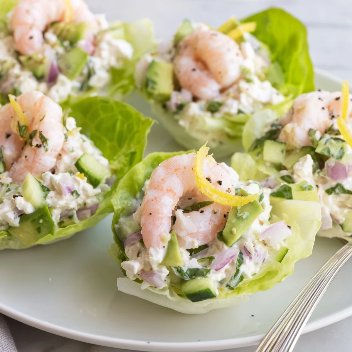 Bright butter lettuce cups filled with Cottage Cheese Lemon Basil Shrimp Salad Cups