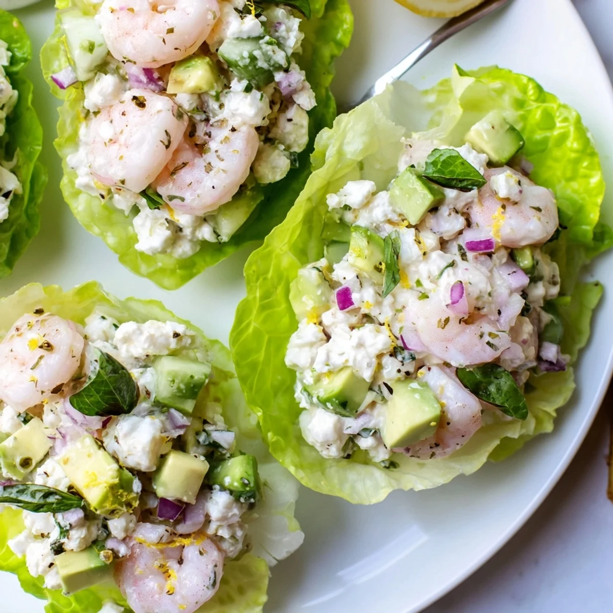 Serve Cottage Cheese Lemon Basil Shrimp Salad Cups chilled, with avocado and basil