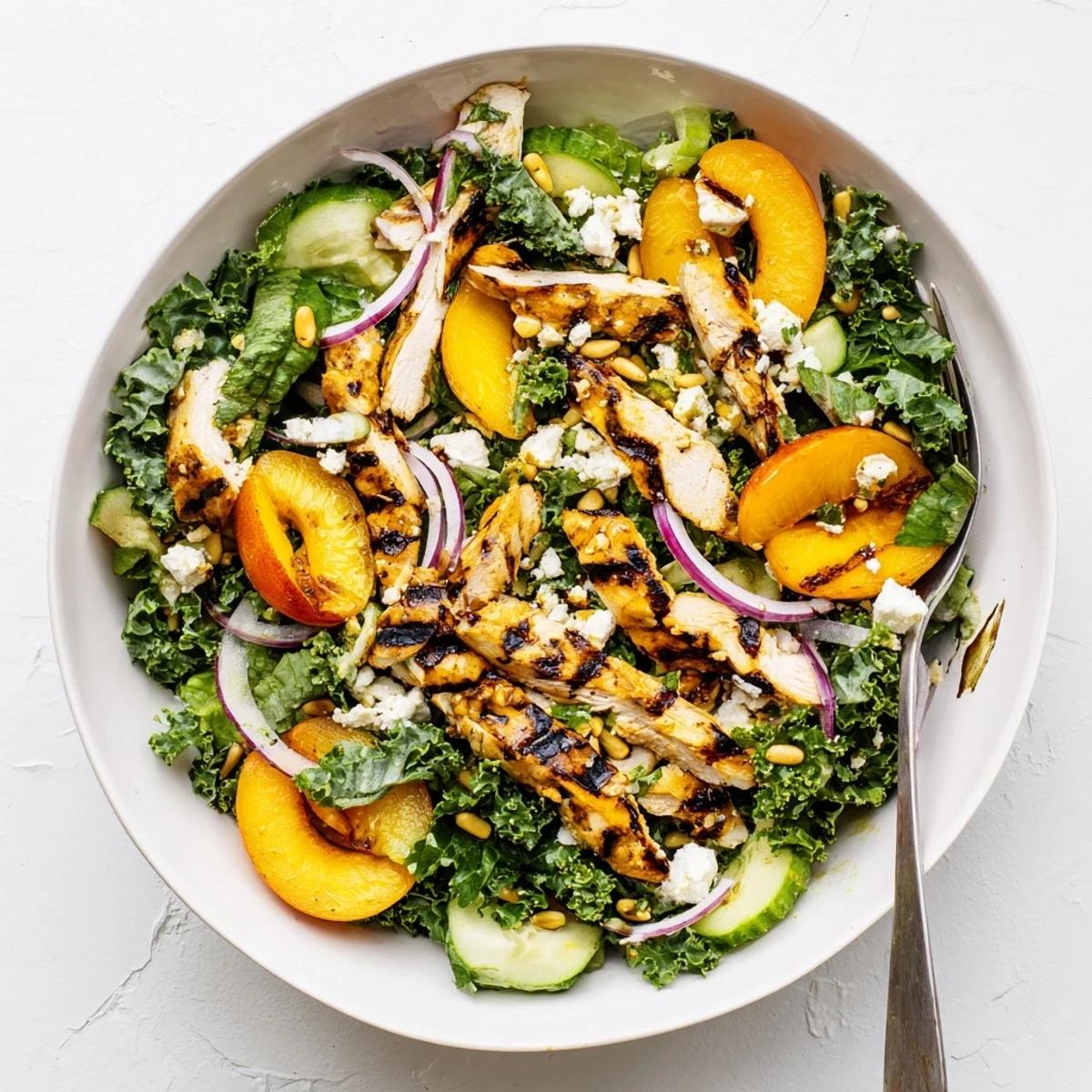 Summer grilled apricot and kale chicken salad drizzled with light honey lemon dressing
