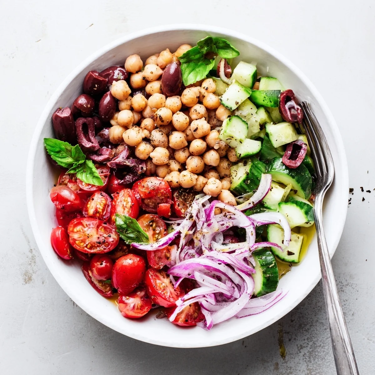 Fresh Mediterranean Chickpea and Tomato Basil Cucumber Salad tossed in olive oil