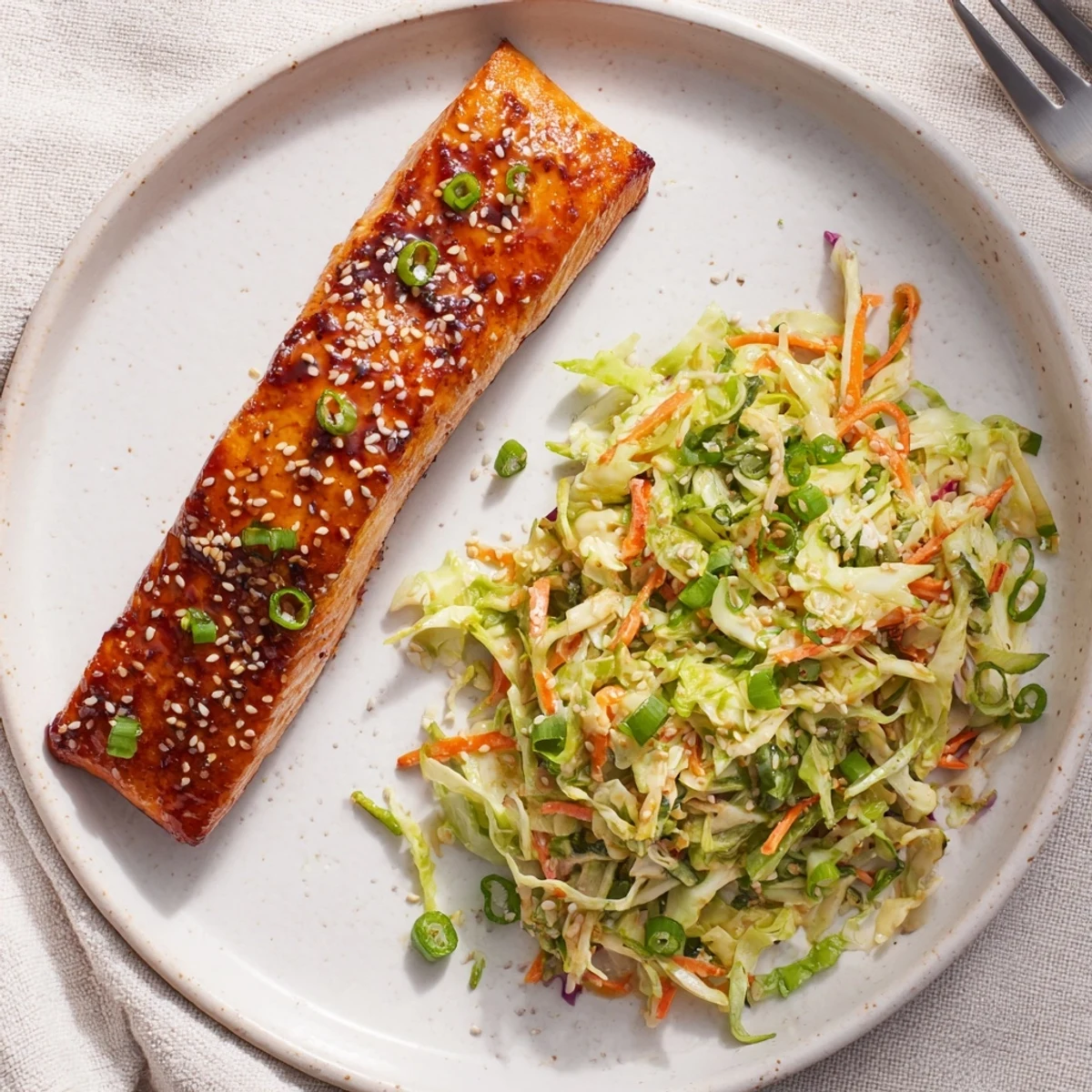 Miso Maple Salmon With Sesame Cabbage Slaw served with glossy caramelized glaze