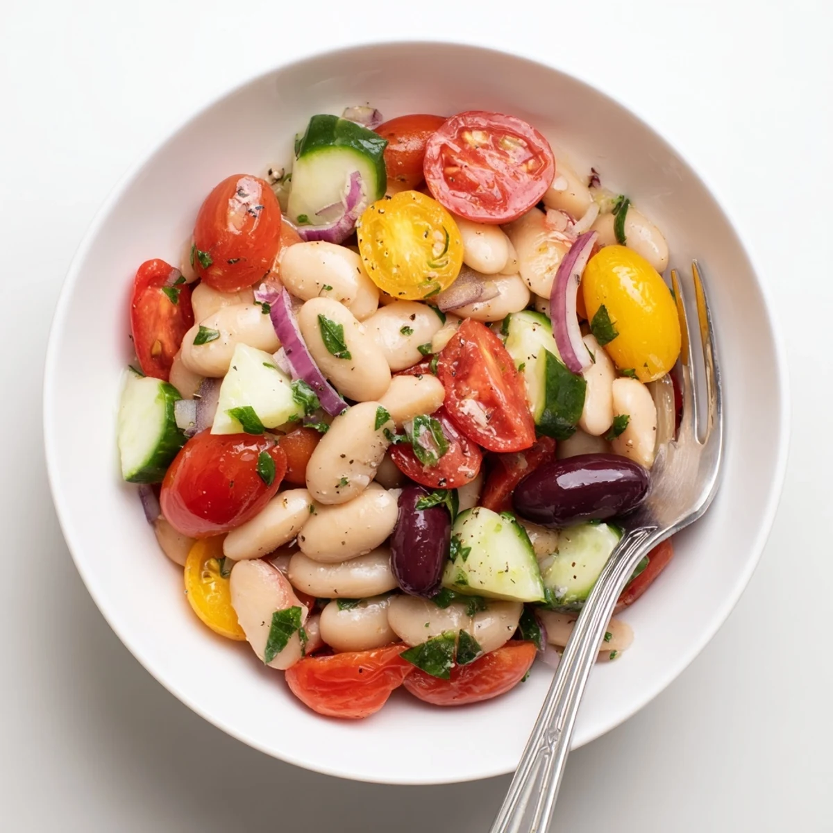 Mediterranean White Bean and Tomato Basil Herb Salad with glossy cherry tomatoes