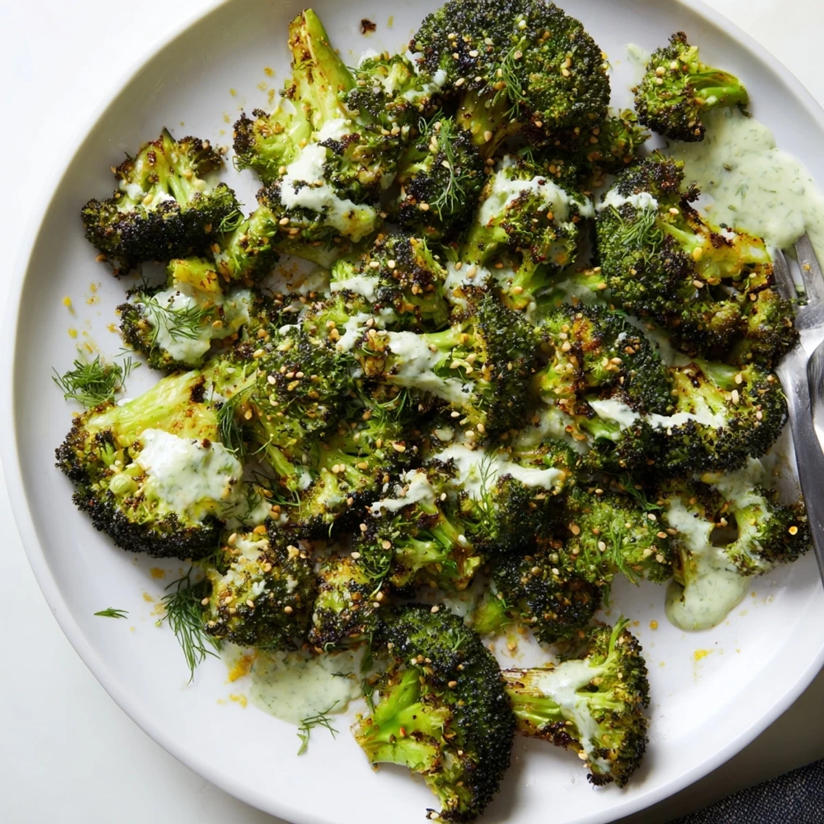 Vibrant Roasted Broccoli With Lemon Herb Tahini Sauce, citrusy aroma, herb-garnished platter