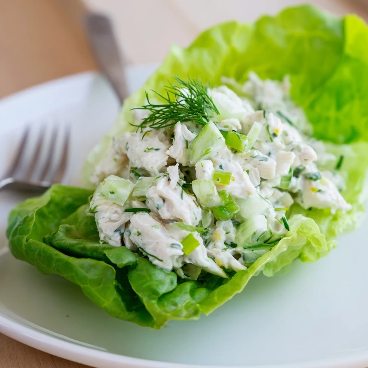 Creamy, tangy Cottage Cheese Lemon Herb Chicken Salad Lettuce Cups in crisp leaves