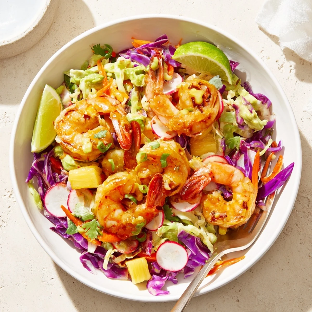 Smoky garlic aroma surrounds Spicy Pineapple Shrimp With Lime Avocado Cabbage Crunch