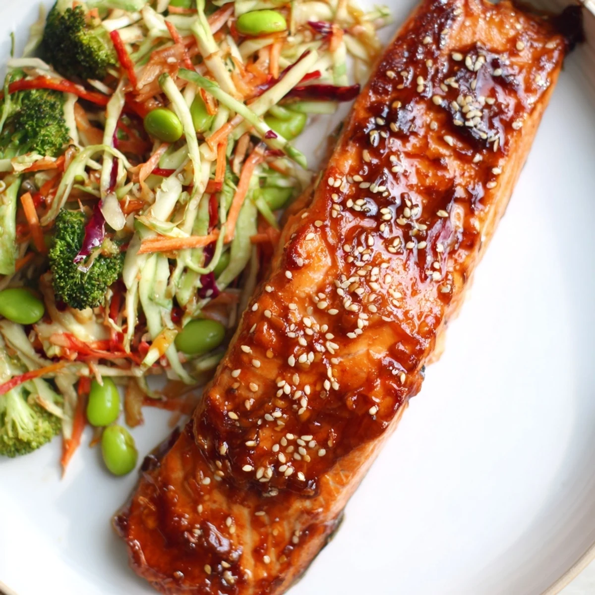 Miso Ginger Salmon With Sesame Broccoli Slaw, glossy miso-glazed fillet atop vibrant slaw