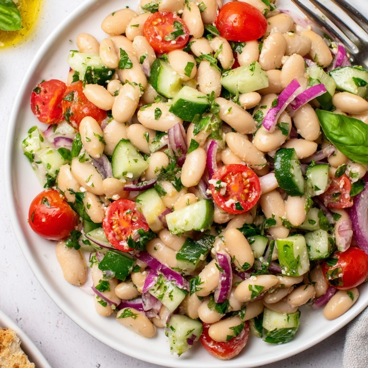 Mediterranean White Bean and Tomato Basil Cucumber Salad with zesty lemon dressing