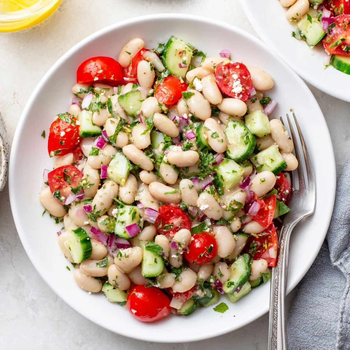 Bright Mediterranean White Bean and Tomato Basil Cucumber Salad served with crusty bread