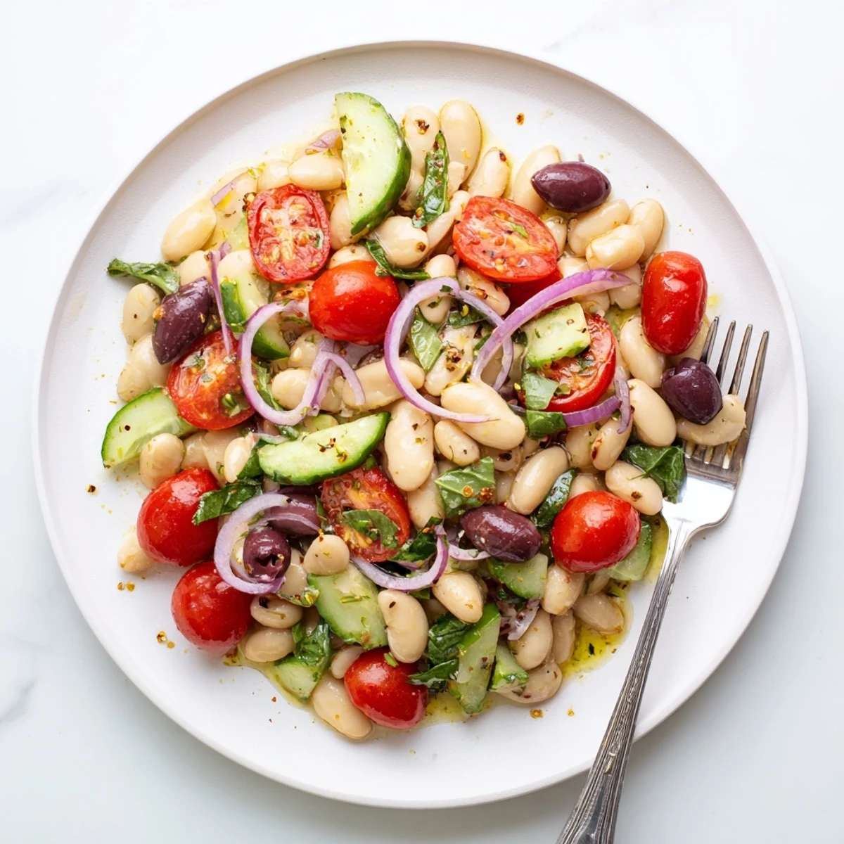 Mediterranean white bean and tomato basil salad tossed in a bright lemon herb dressing