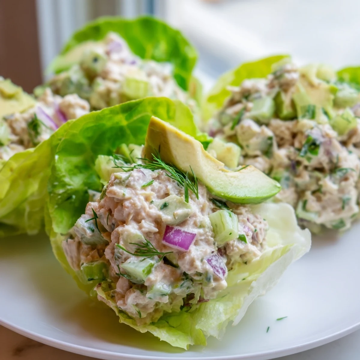Creamy cottage cheese lemon herb tuna salad served in crisp green butter lettuce cups