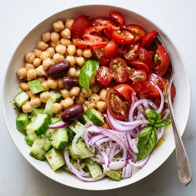 Mediterranean Chickpea and Tomato Basil Cucumber Salad served chilled with warm pita