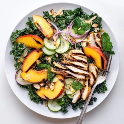 Smoky grilled nectarine and kale chicken salad drizzled with bright honey lemon dressing